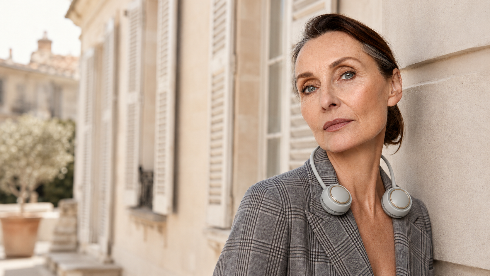 Woman wearing a Seranzio bladeless neck fan outdoors